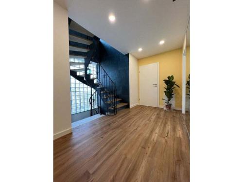 an empty room with a spiral staircase in a house at Holiday home with 2 bedrooms in Schopfloch