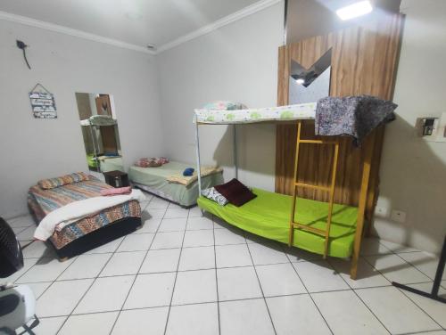 a room with two bunk beds in it at Pousada Nova Jerusalém in Cianorte