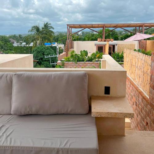 a couch sitting on top of a roof at Casa Xaviera in Puerto Escondido