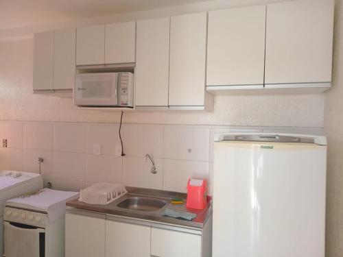 Dapur atau dapur kecil di Conforto e praia no litoral da Bahia