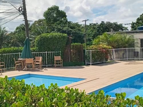 Kolam renang di atau dekat dengan Conforto e praia no litoral da Bahia