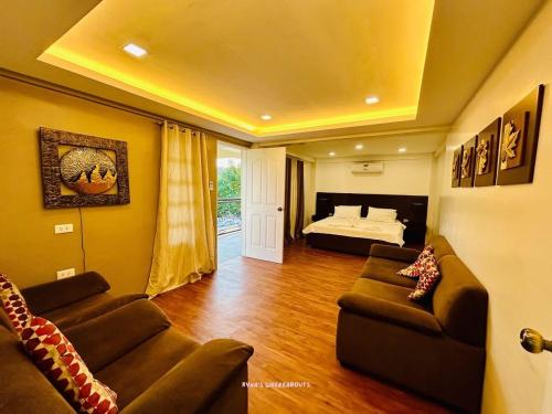 a large living room with a bed and a couch at Villa Kathreyna Private Resort in Alianza