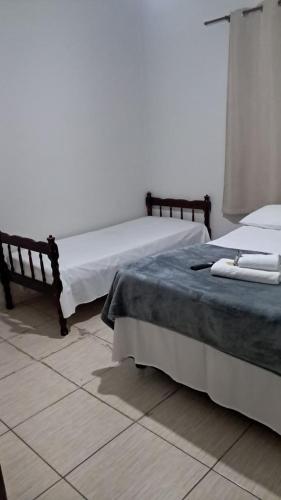 two beds sitting next to each other in a room at Hotel Eldorado in Eldorado