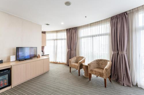 Super Candle Hotelにあるテレビまたはエンターテインメントセンター