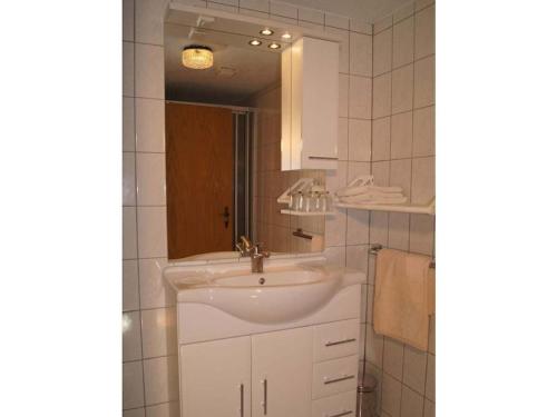 a bathroom with a sink and a mirror at Holiday apartment with 2 bedrooms in Eggenthal
