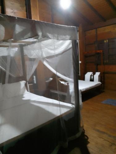 a room with two bunk beds in a cabin at The Cinnamon Farm Wooden Cabana Unawatuna in Unawatuna