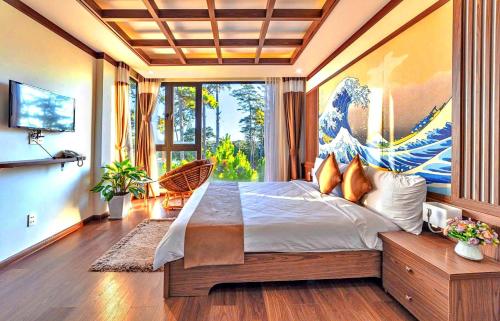 a bedroom with a large bed and a large window at S79 Residences Khai Ngoc Dalat in Da Lat