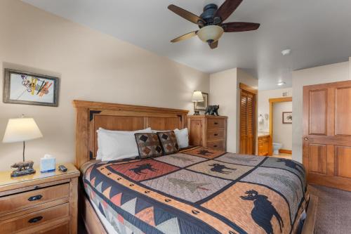 a bedroom with a bed and a ceiling fan at Springs 8845 by Summit County Mountain Retreats in Snake River Health Services Incorporated Heliport