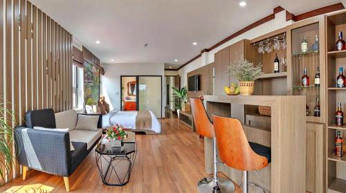 a living room with a couch and some chairs at S79 Residences Khai Ngoc Dalat in Da Lat