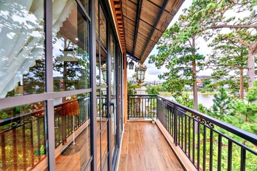 a balcony of a house with a view of the water at S79 Residences Khai Ngoc Dalat in Da Lat