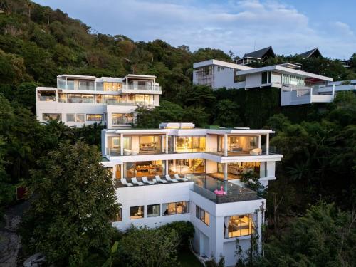 an aerial view of a large white building at Seascape 6BR Prestige Villa Skyline Pool in Kamala Beach