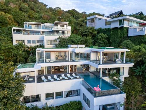 an aerial view of a house with a swimming pool at Seascape 6BR Prestige Villa Skyline Pool in Kamala Beach