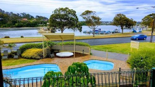 a view of two swimming pools in a park at Lakeside 2-Bedroom Villa in Lakes Entrance