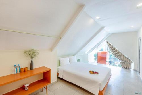 Кровать или кровати в номере Bazan Dalat Hotel
