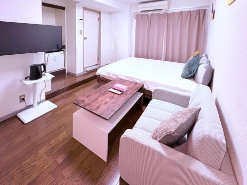 TV a/nebo společenská místnost v ubytování Nogata House