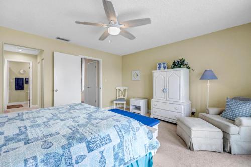 a bedroom with a bed and a ceiling fan at Beachy Vibes in Ponte Vedra Beach