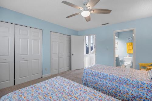 a bedroom with two beds and a ceiling fan at Beachy Vibes in Ponte Vedra Beach