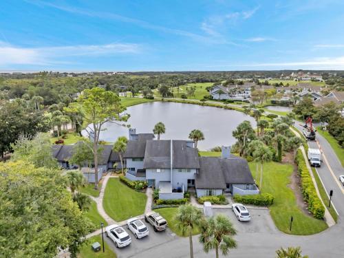 an aerial view of a house with a lake at Beachy Vibes in Ponte Vedra Beach
