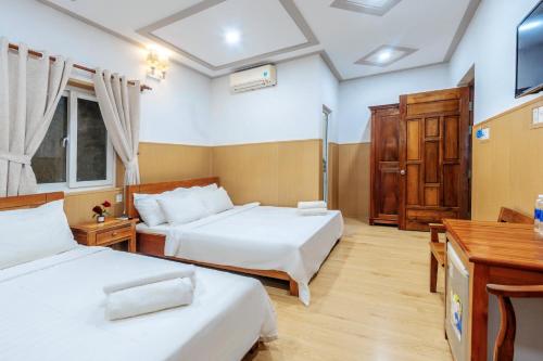 Ein Bett oder Betten in einem Zimmer der Unterkunft Cherry Bean Hotel - Night Market