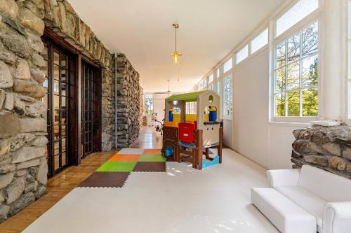 a living room with a lego table and a wall at Lakeview-Sleeps 12-King Suites-7BR - Firepit in Monroe