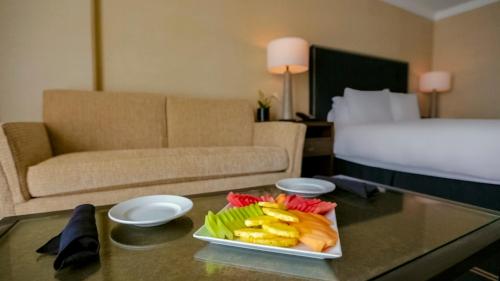a tray of fruit on a table in a hotel room at Grand Hotel in Sunnyvale