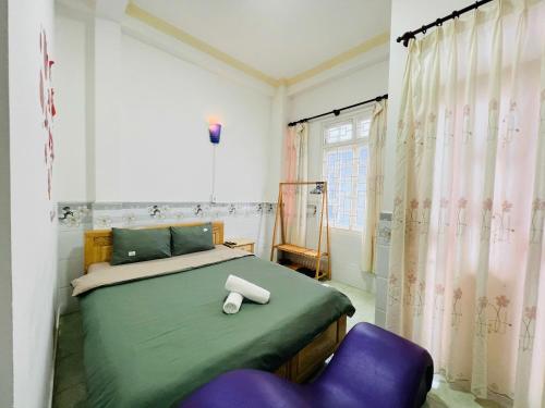 Un pat sau paturi într-o cameră la Hà An Homestay Nguyên Căn