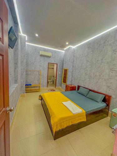 a bedroom with a large bed in a room at Cozy Home Cần Thơ in Can Tho