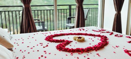 a cake with a number seven on a table at CARMEL HOME STAY in Munnar