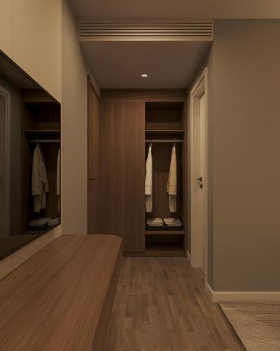 a hallway with a walk in closet with hangers at Nature Hotel - Lac Long Quan in Hanoi