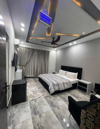 a bedroom with a bed and a tv on the ceiling at Holiday Inn islamabad in Islamabad