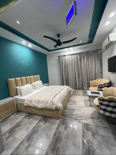 a bedroom with a bed and a tv on the ceiling at Holiday Inn islamabad in Islamabad