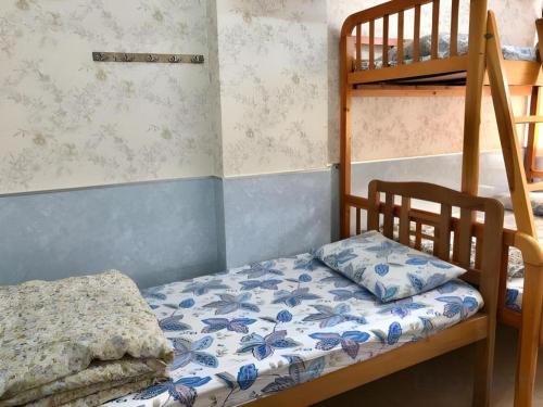 Ένα ή περισσότερα κρεβάτια σε δωμάτιο στο Dragon Hostel Hong Kong