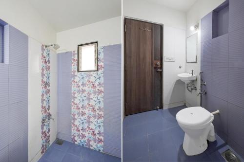 a bathroom with a toilet and a sink at Super Collection O Sachivalaya Metro Station Gandhinagar Formerly Hotel Ghunghat Inn in Gandhinagar