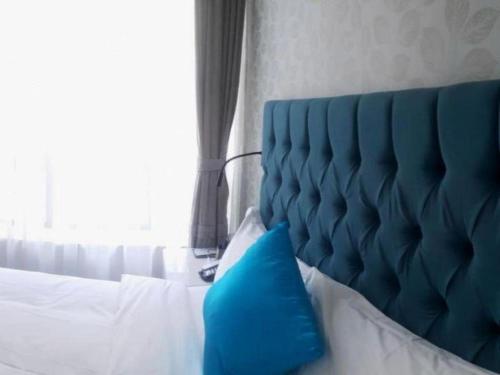Postel nebo postele na pokoji v ubytování Shanghai Jinchen Hotel