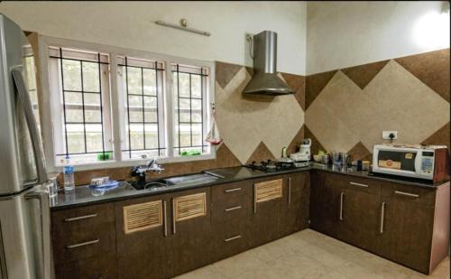 Kuchyň nebo kuchyňský kout v ubytování Coffee Cottage Coorg