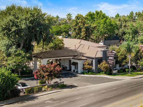 an overhead view of a inn with a road at University Park Inn & Suites, an Ascend Collection Hotel in Davis
