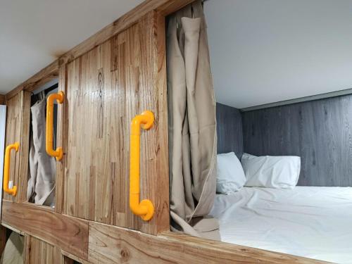 a wooden cabin with a bed in it at VNJ Capsule 388 in Hoi An