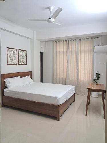 Postel nebo postele na pokoji v ubytování La Vita Oasis