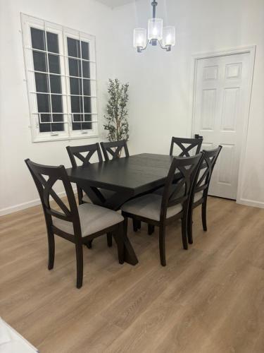 a dining room table and chairs in a room at Luxury Apartments in Georgetown