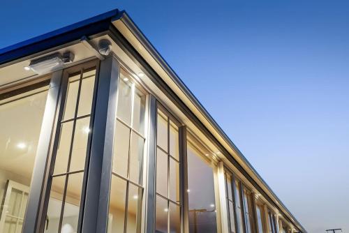 a building with glass windows on the side of it at Deluxe Twin Room at Wolfe Street in Whangarei