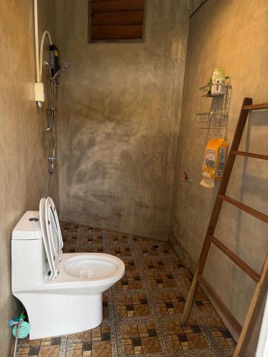 a bathroom with a toilet and a shower at Poka-Homestay in Ban Pok Nai