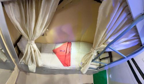 Кровать или кровати в номере Welcome Inn Dormitory & PG Male And Female