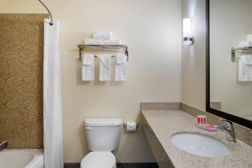 a bathroom with a toilet and a sink at Econo Lodge Inn & Suites Springfield Main Street in Springfield