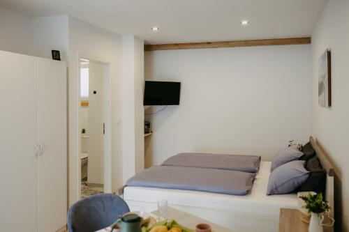 Una cama o camas en una habitación de Apartment Sabine