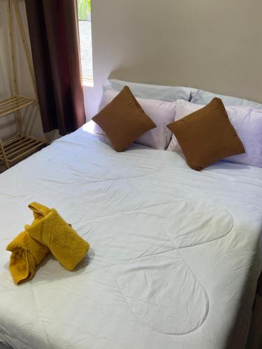 Postel nebo postele na pokoji v ubytování Amani village
