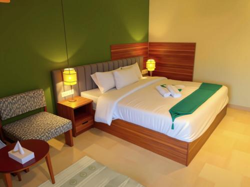 a rendering of a bedroom with a bed and a chair at Pyramids Nomad View Hotel in Cairo