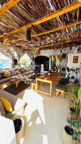 a living room with a couch and a table at Nebro Nubian Guest House - Adults Only in Aswan