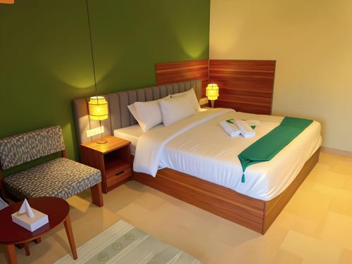 a rendering of a bedroom with a bed and a chair at Pyramids Nomad View Hotel in Cairo