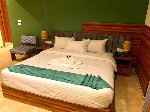 a bedroom with a bed with a dress on it at Pyramids Nomad View Hotel in Cairo