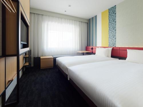 Katil atau katil-katil dalam bilik di Mitsui Garden Hotel Kyoto Shijo